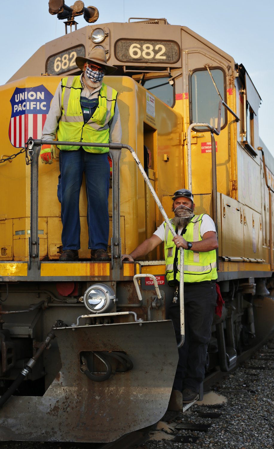 Engineer Deprimethon V. Lee (left) and conductor Chris Nichols ready locomotive 682 for her daily run out of the West Mineola yard. See story Page 3A.